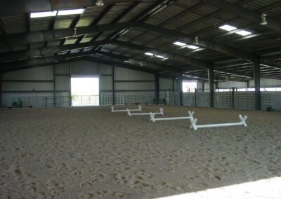 Metal Arena building interior with roll up door